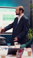 Business manager does handshake with a new employee during a briefing meeting, welcoming her to the team and presenting her to other staff members. Young man shaking hands with trainee. Camera B. video