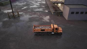 Dump Truck Parked Next to Building in Parking Lot video