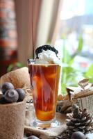 Refreshing Glass of Iced Tea With Whipped Cream photo