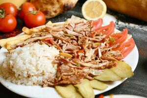 White Plate With Meat and Vegetable Topping photo