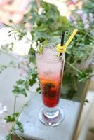 Tall Glass Filled With Clear Liquid and Straw photo