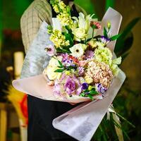 Person Holding a Bouquet of Flowers photo