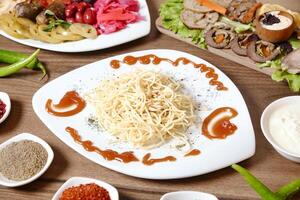 Colorful Plated Food With Savory Sauces on a Table photo