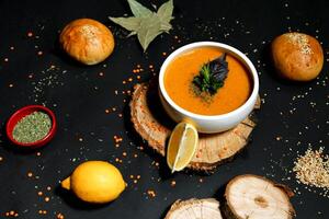 Bowl of Soup With Slice of Lemon on the Side photo