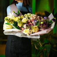 Woman Holding Bouquet of Flowers photo