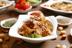 Wooden Table With Assorted Bowls of Food photo