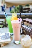 Glass of Refreshing Beverage on Table photo