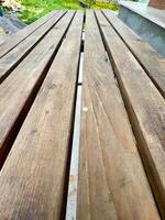 Close-Up of Wooden Bench in Park photo