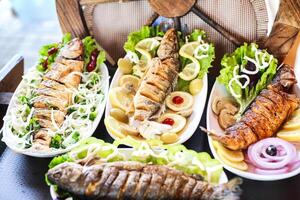 Table Adorned With Plates Showcasing a Variety of Delectable Foods photo