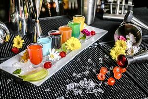 Plate of Assorted Fruits and Refreshing Drinks on Table photo