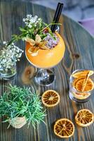 Wooden Table With Orange Slices and Drinks photo