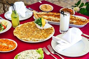 Red Table With Plates of Food photo