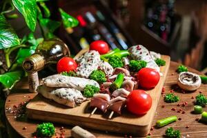 Wooden Cutting Board With Meat and Veggie Assortment photo