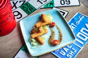 Blue Plate With Food on Wooden Table photo