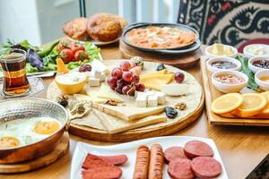 Wooden Table Adorned With Plates of Food photo