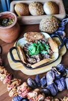 Variety of Food Presented on Wooden Table photo