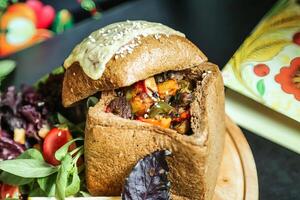 Close-up of a Deli Sandwich on a White Plate photo