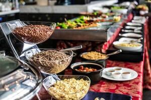 Buffet Line With Cereal Bowls and Assorted Foods photo