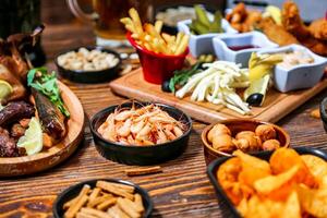 Wooden Table Displaying Assorted Food Bowls photo