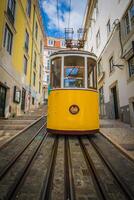 Romantic yellow tramway - main symbol of Lisbon, Portugal photo