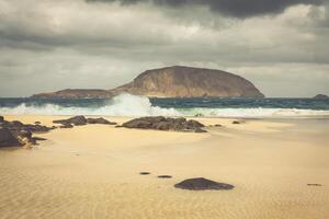 A view of Playa de Las Conchas, a beautiful beach on La Graciosa, a small island near Lanzarote, Canary Islands, in the middle of the Atlantic Ocean. photo