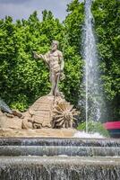 Fountain of Neptune Fuente de Neptuno one of the most famous landmark of Madrid, Spain photo