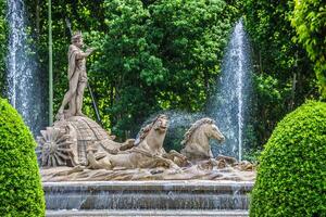 Fountain of Neptune Fuente de Neptuno one of the most famous landmark of Madrid, Spain photo