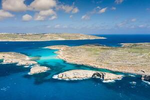 Aerial drone photo - The famous Blue Lagoon in the Mediterranean Sea. Comino Island, Malta.