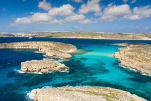 Aerial drone photo - The famous Blue Lagoon in the Mediterranean Sea. Comino Island, Malta.