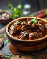 beef rendang or meat stew on a bowl with field of depth photo