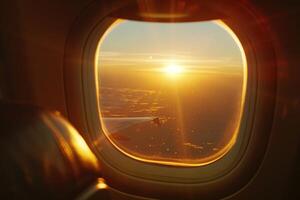 Airplane window from inside during sunset photo