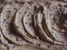 Close-up of chocolate chip ice cream texture for food background photo