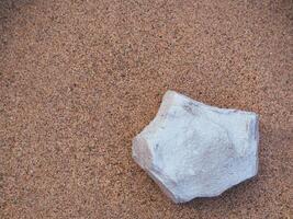 Silver rock on sand for product display or background ,copy space photo