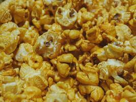 Delicious sweet popcorn, close-up shot for dessert food background. photo