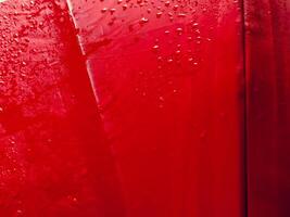 Red umbrella texture with water drops for rainy day background. photo