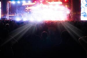 Group of people having fun at music concert photo