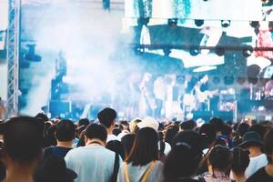 Group of people having fun at music concert photo