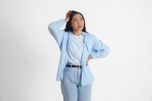 A sad Asian woman looks stressed and depressed or having headache, isolated white background. photo