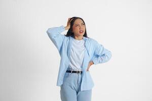 A sad Asian woman looks stressed and depressed or having headache, isolated white background. photo