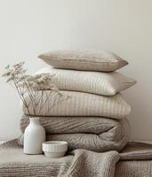 Neatly Stacked Blankets and Pillows on a Bed photo