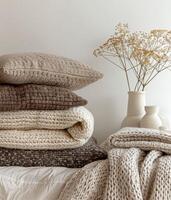 Neatly Stacked Blankets and Pillows on a Bed photo