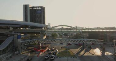 Aerial view of Bangkok downtown, Sky train station, Cars on traffic road and buildings, Thailand video