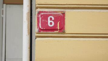 house number. Decorative lettering on a brick wall. video