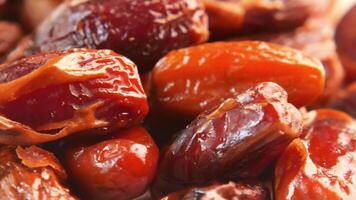 close up of rotating fresh date fruit in a bowl on table video