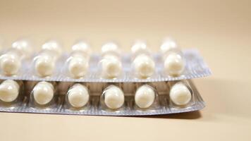 Close up of pills of blister pack on table video