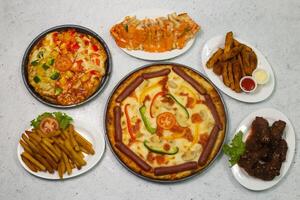 sausage pizza, vegetable pizza, Chicken cheese sandwich, naga chicken wings, masala wedges, french fries photo