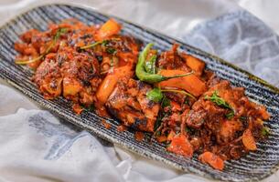 chicken sukka fried served in dish isolated on food table top view of middle east spices photo