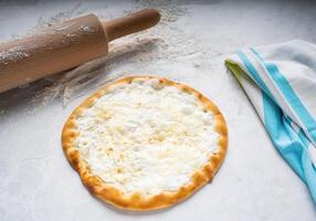 Plain Labneh pizza isolated on table top view of arabic food photo