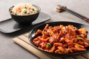 Beef Mongolian with Vegetable Fried Rice and chopsticks served in dish isolated on background top view of chinese food photo