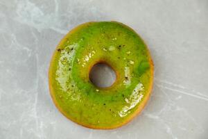 Lemon Pistachio Donut Isolated on grey background top view of baked breakfast food photo